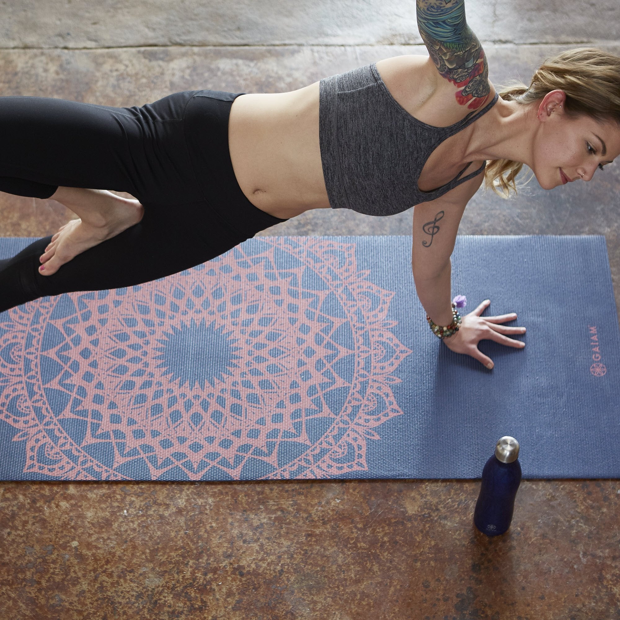 woman doing yoga on Navy Fleur Marrakesh Yoga Mat